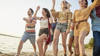 group-young-people-running-beach